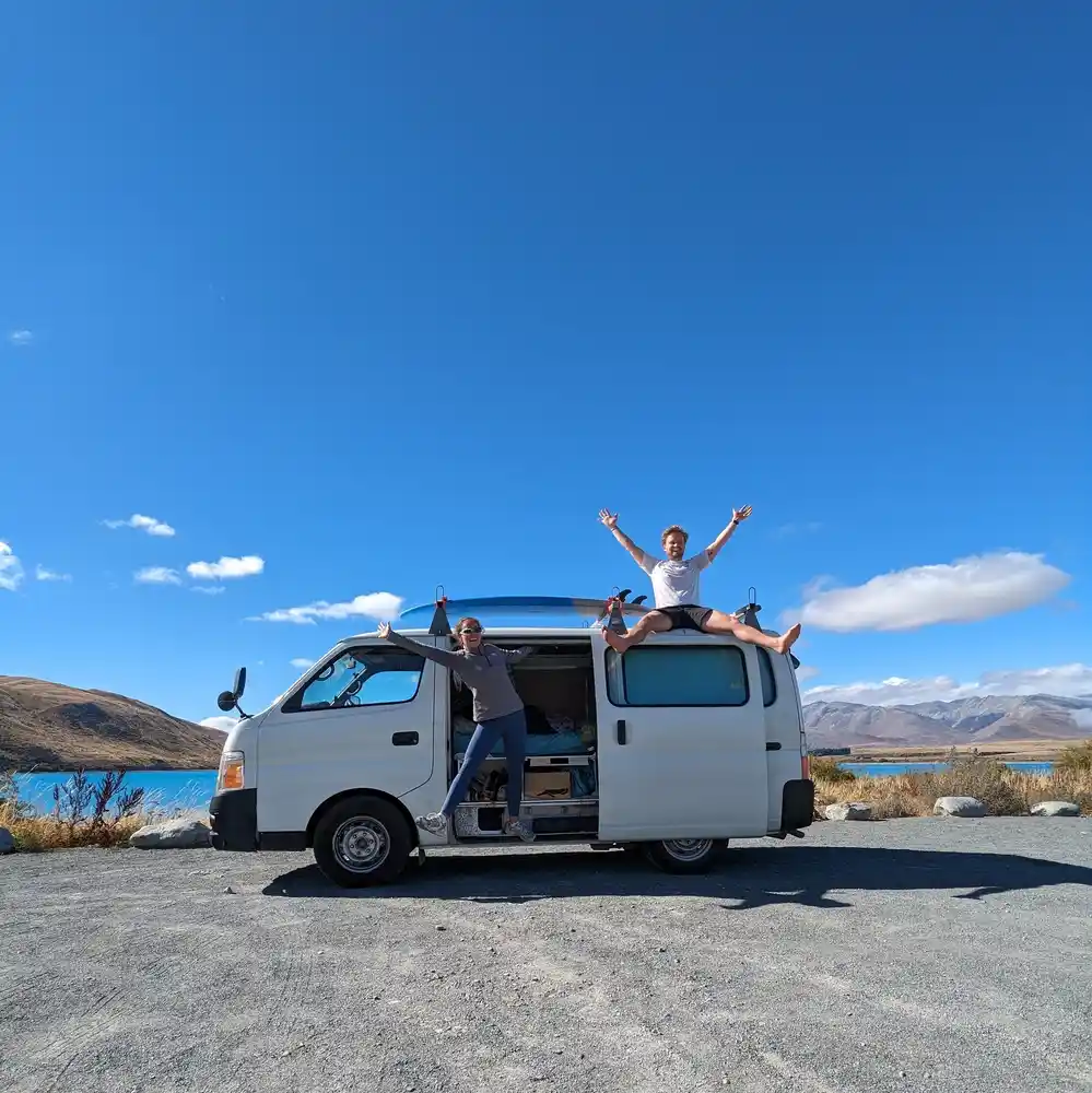 Toyota Hiace campervan at Lake Tekapo with mountain views